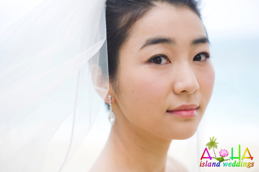 beautiful bride in Hawaii looking at camera